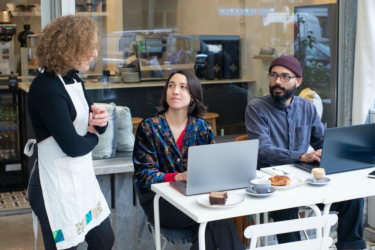 waitress talking to customers